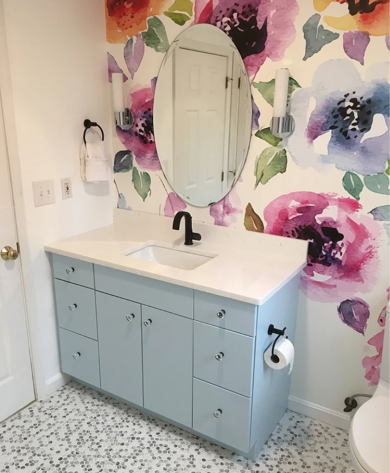 Floral wallpaper bathroom with blue vanity