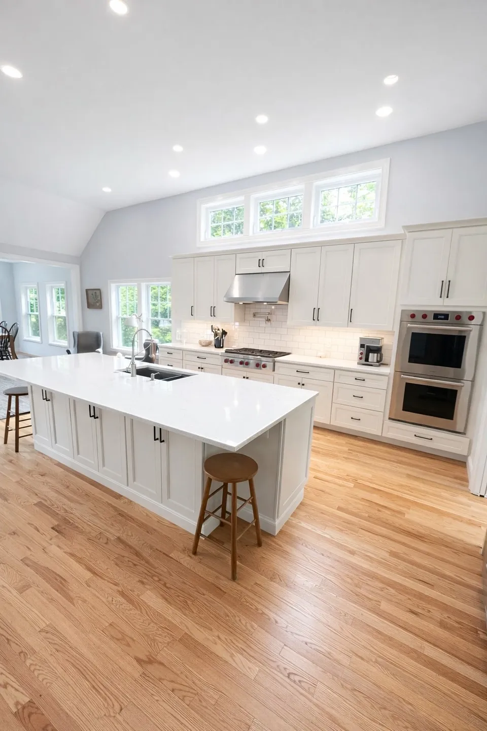Spacious kitchen with hardwood floors and island